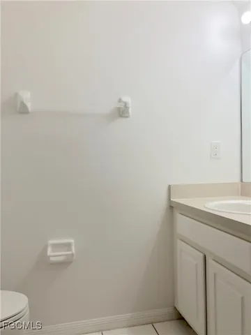 a bathroom with a sink and vanity