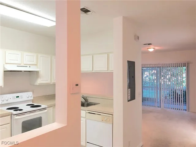 a kitchen with a stove and a refrigerator