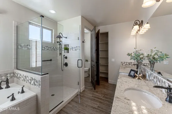 a large bathroom with double vanity and a mirror