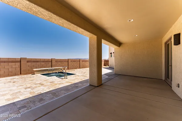 a swimming pool with a yard and balcony