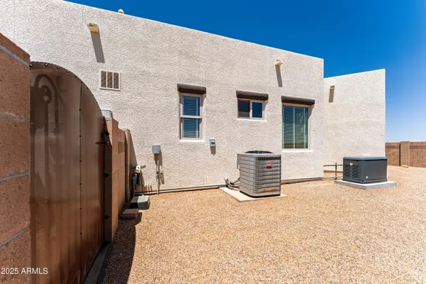 a view of a house with a yard and mountain view