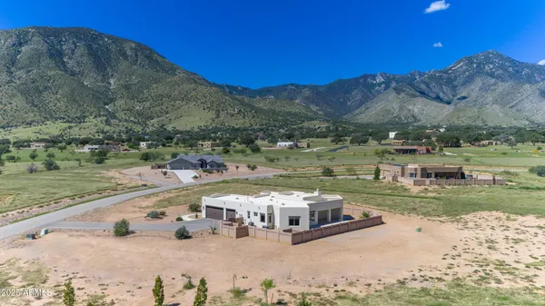 a view of a swimming pool with a yard