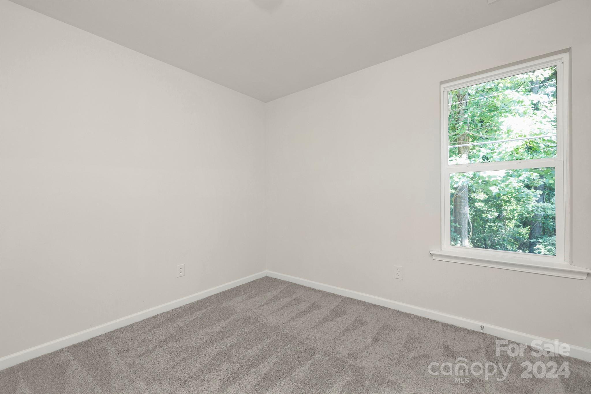 310 Morningside Road Charlotte, NC 28214 - Photo 15 of 23 an empty room with a window