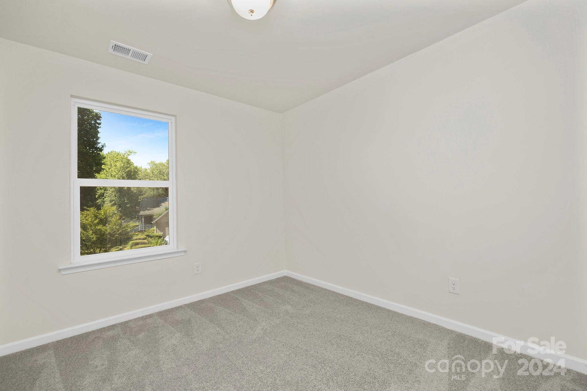 310 Morningside Road Charlotte, NC 28214 - Photo 16 of 23 an empty room with a window