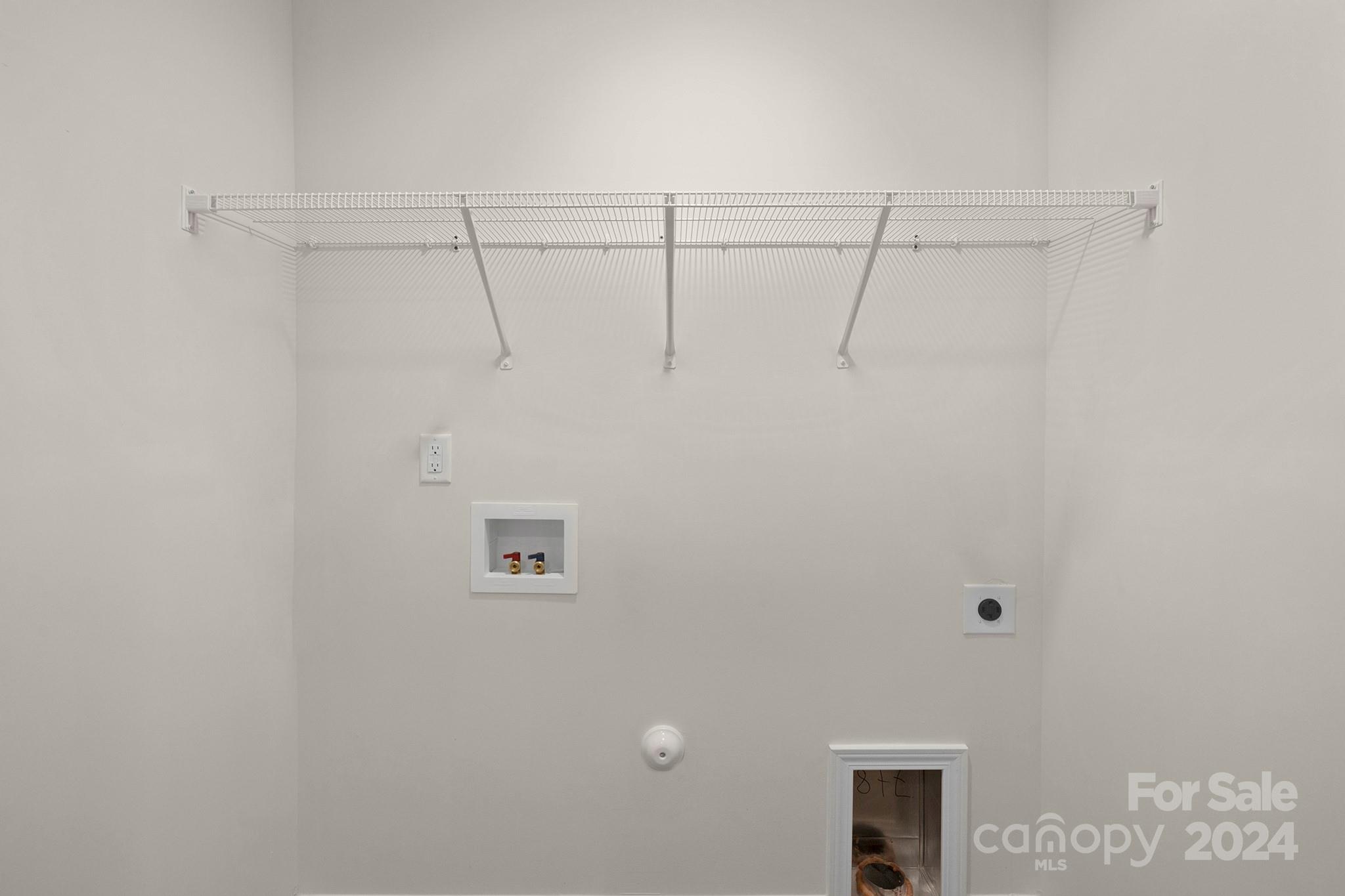 310 Morningside Road Charlotte, NC 28214 - Photo 18 of 23 a view of a room with racks on the wall
