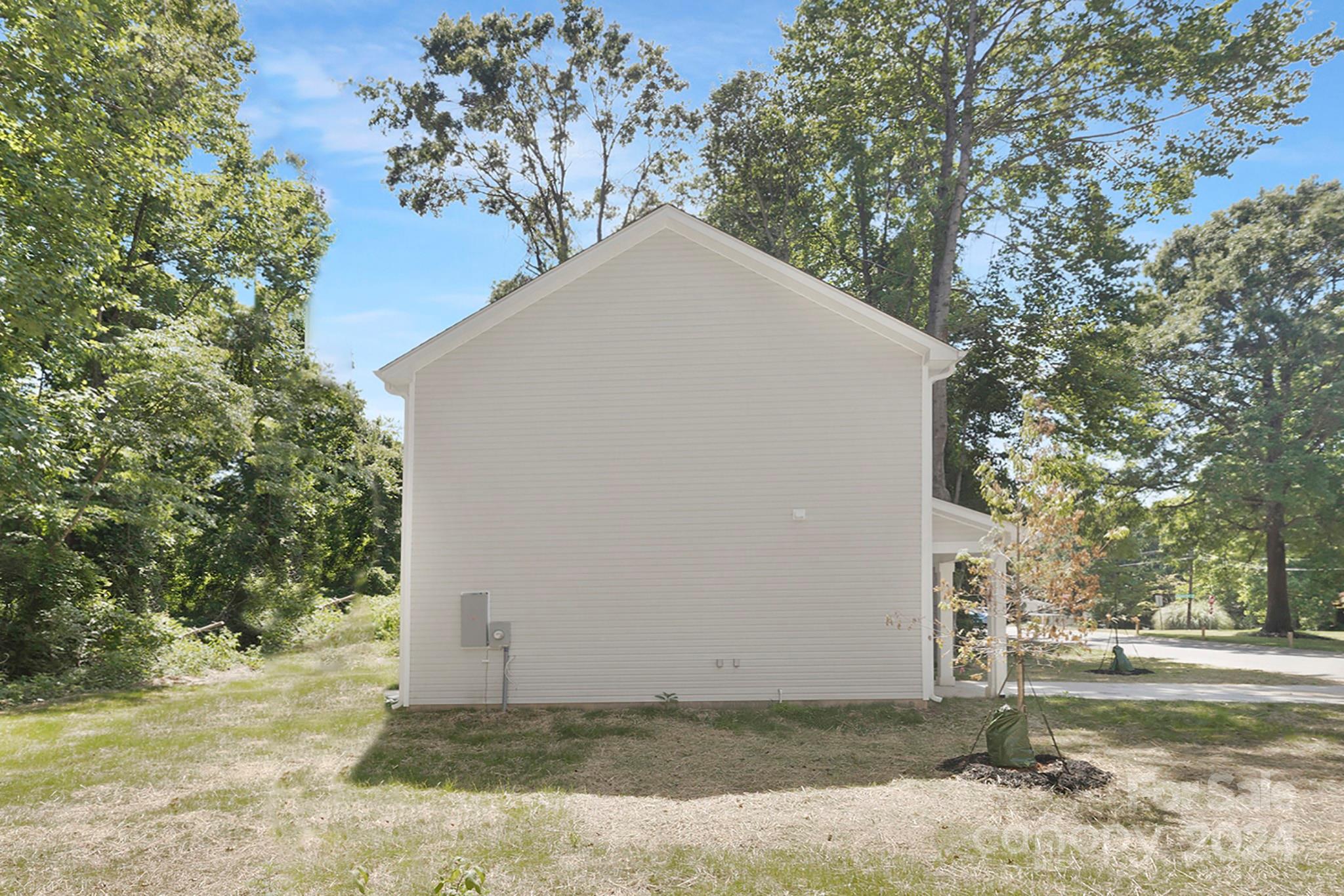 310 Morningside Road Charlotte, NC 28214 - Photo 21 of 23 a view of a house with a yard and large tree