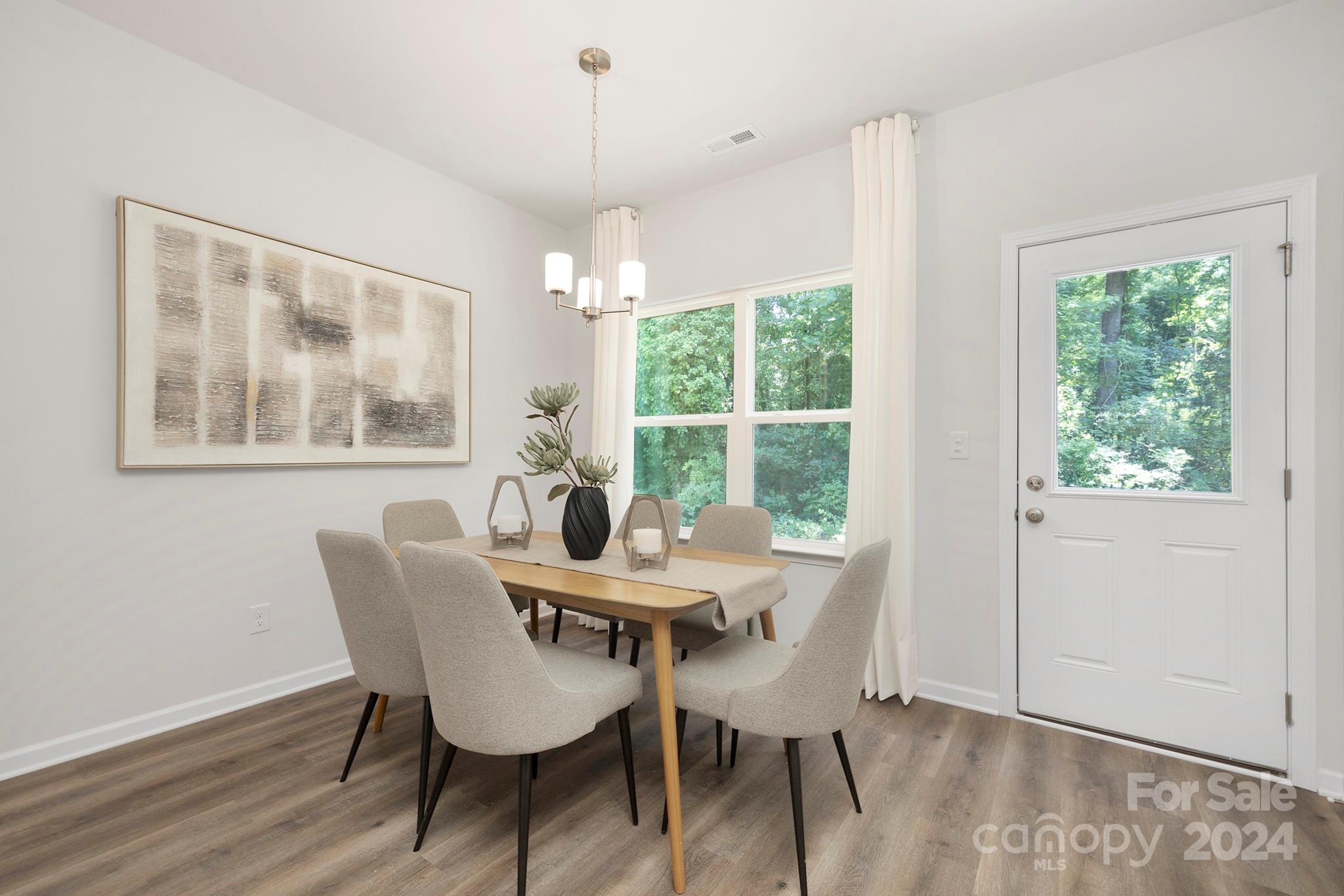 310 Morningside Road Charlotte, NC 28214 - Photo 3 of 23 a view of a dining room with furniture window and outside view
