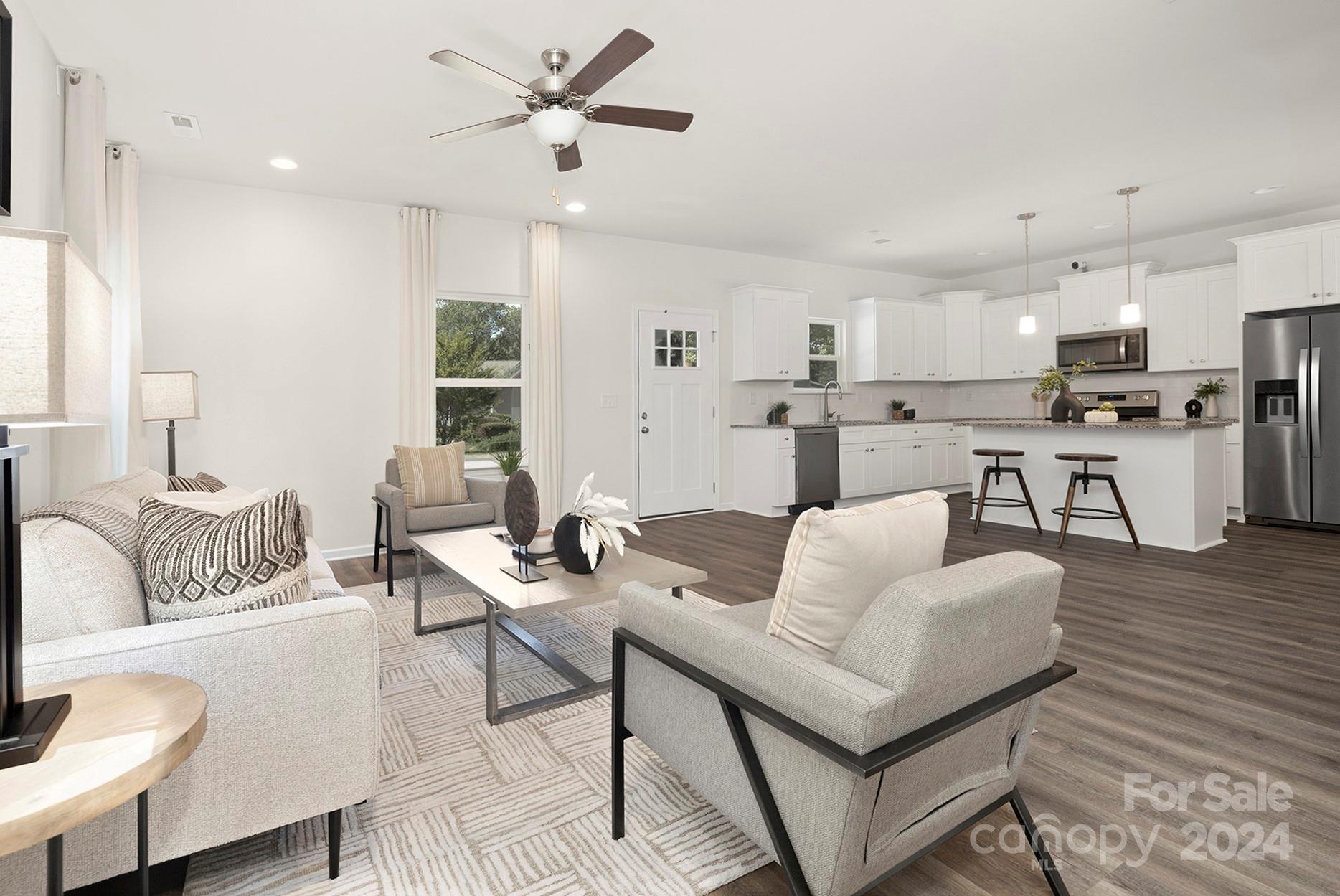 310 Morningside Road Charlotte, NC 28214 - Photo 7 of 23 a living room with furniture and kitchen view