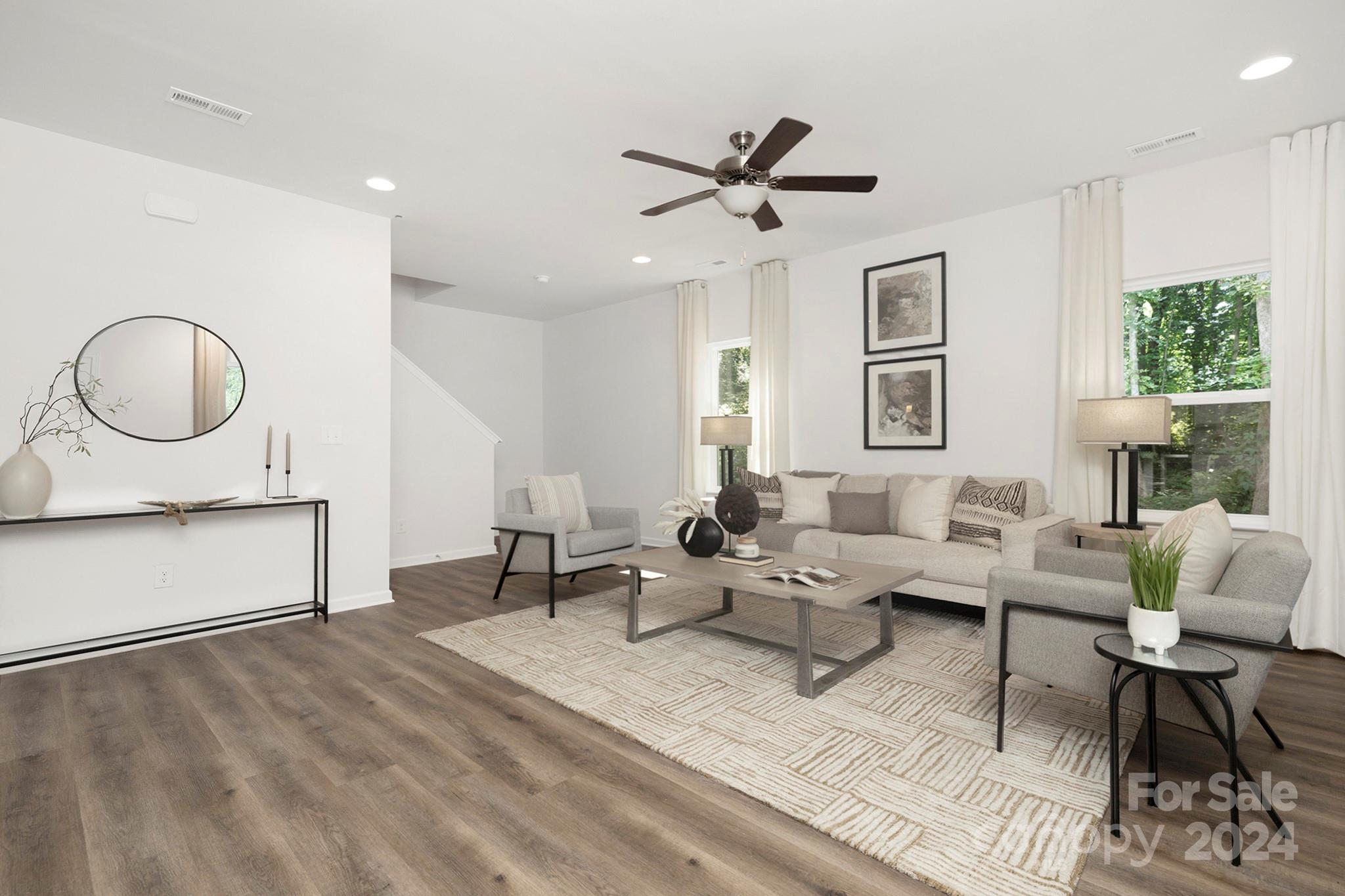 310 Morningside Road Charlotte, NC 28214 - Photo 8 of 23 a living room with furniture and a large window