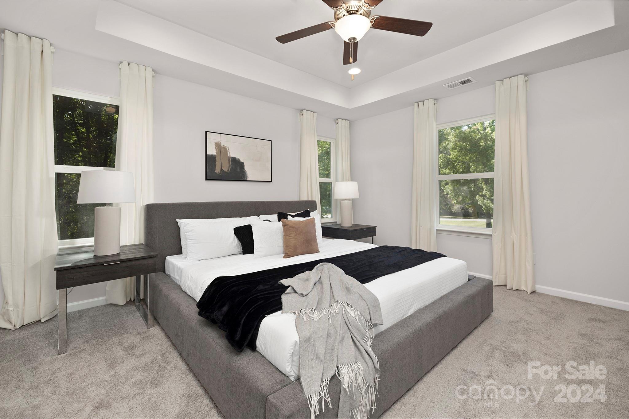 310 Morningside Road Charlotte, NC 28214 - Photo 9 of 23 a bedroom with a large bed and a window