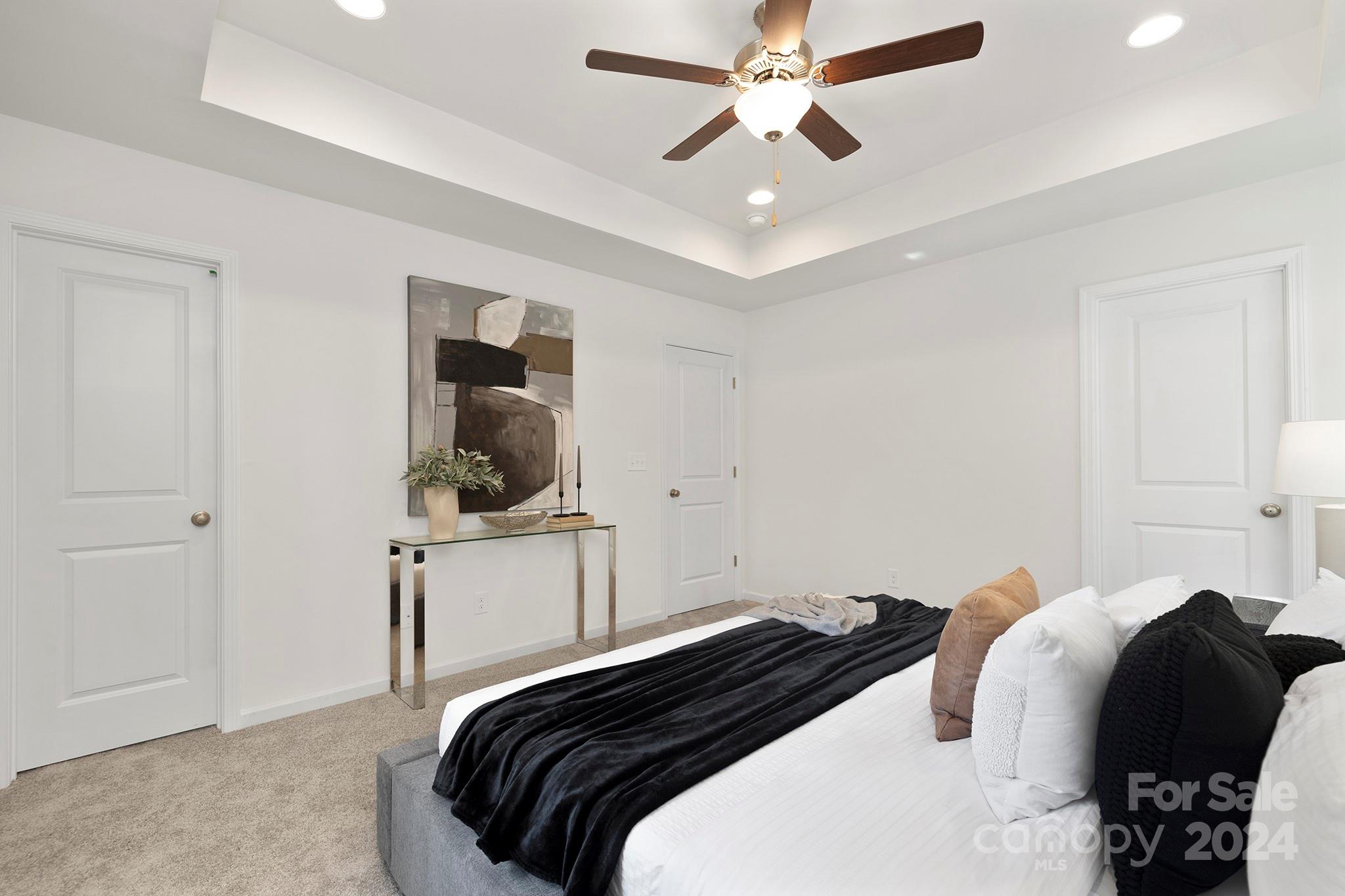 310 Morningside Road Charlotte, NC 28214 - Photo 10 of 23 a bedroom with a bed and a ceiling fan