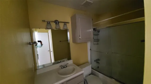 a bathroom with a sink and shower