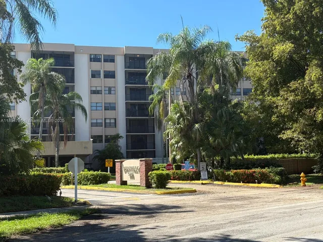 a tall building sitting on the side of a road