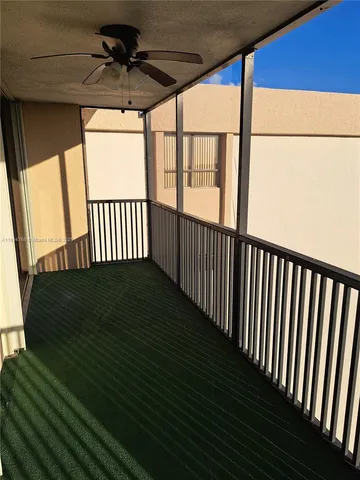 a view of porch with wooden floor