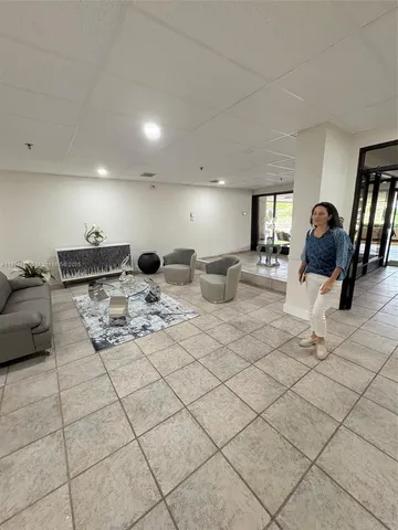 a large room with lots of chairs and mirrors