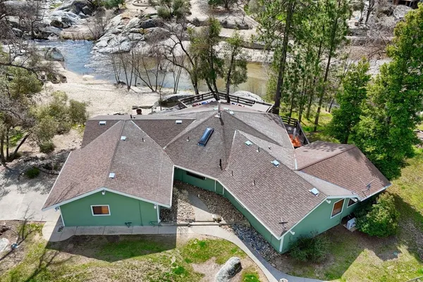 a aerial view of a house with a yard