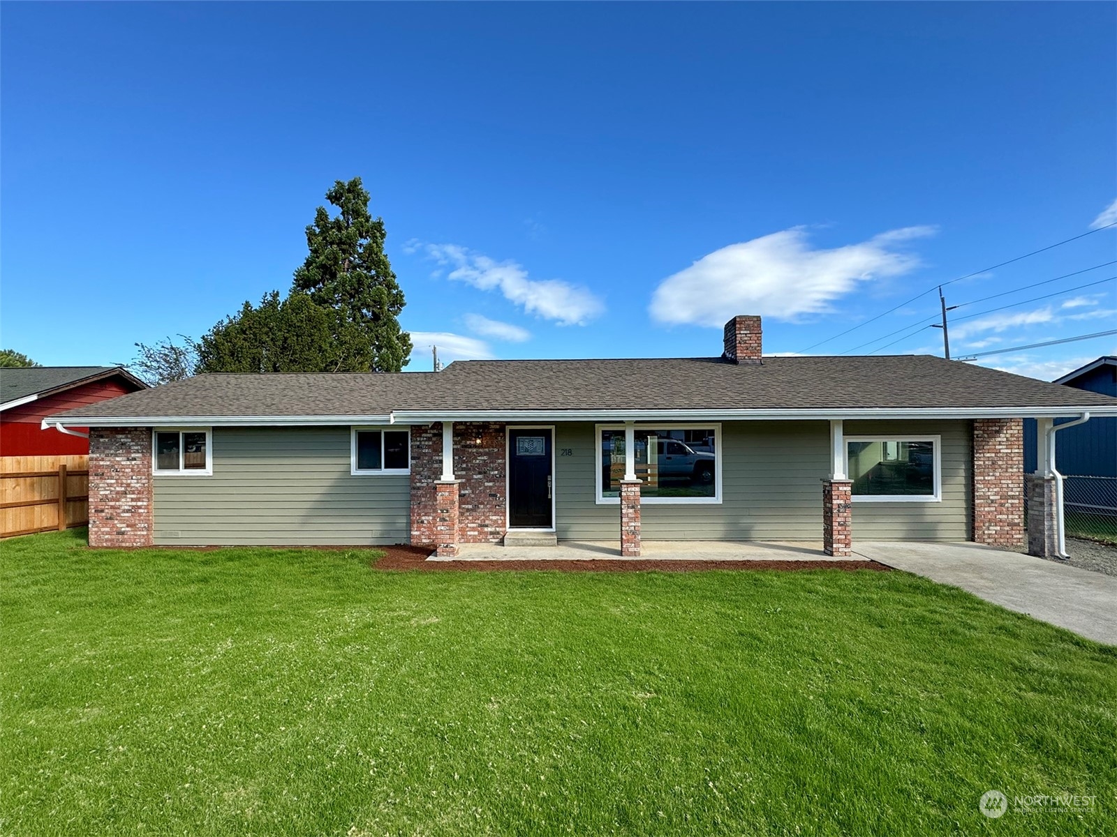 218 North Matriotti Avenue Sequim, WA 98382 - Photo 1 of 40 a front view of a house with garden
