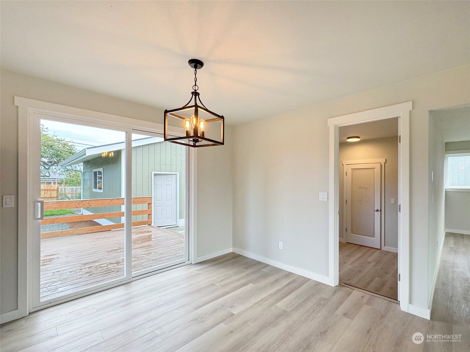 218 North Matriotti Avenue Sequim, WA 98382 - Photo 13 of 40 a view of empty room with wooden floor and fan