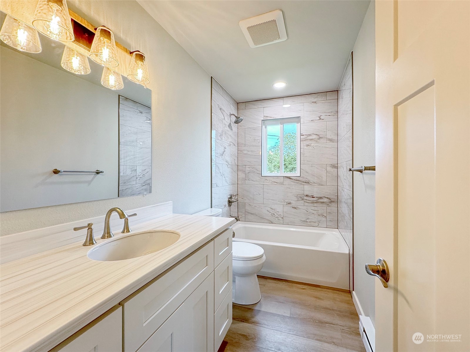 218 North Matriotti Avenue Sequim, WA 98382 - Photo 19 of 40 a bathroom with a granite countertop sink a toilet and shower