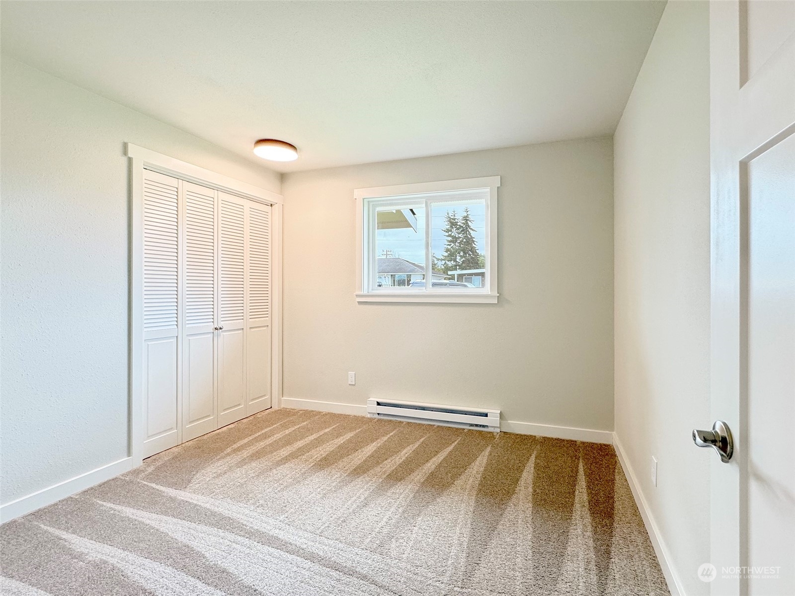 218 North Matriotti Avenue Sequim, WA 98382 - Photo 20 of 40 a view of a room with wooden floor and closet