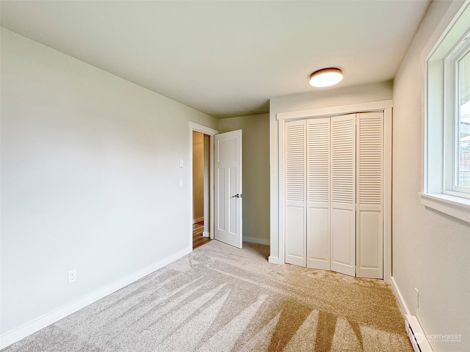 218 North Matriotti Avenue Sequim, WA 98382 - Photo 23 of 40 a view of an empty room with a window