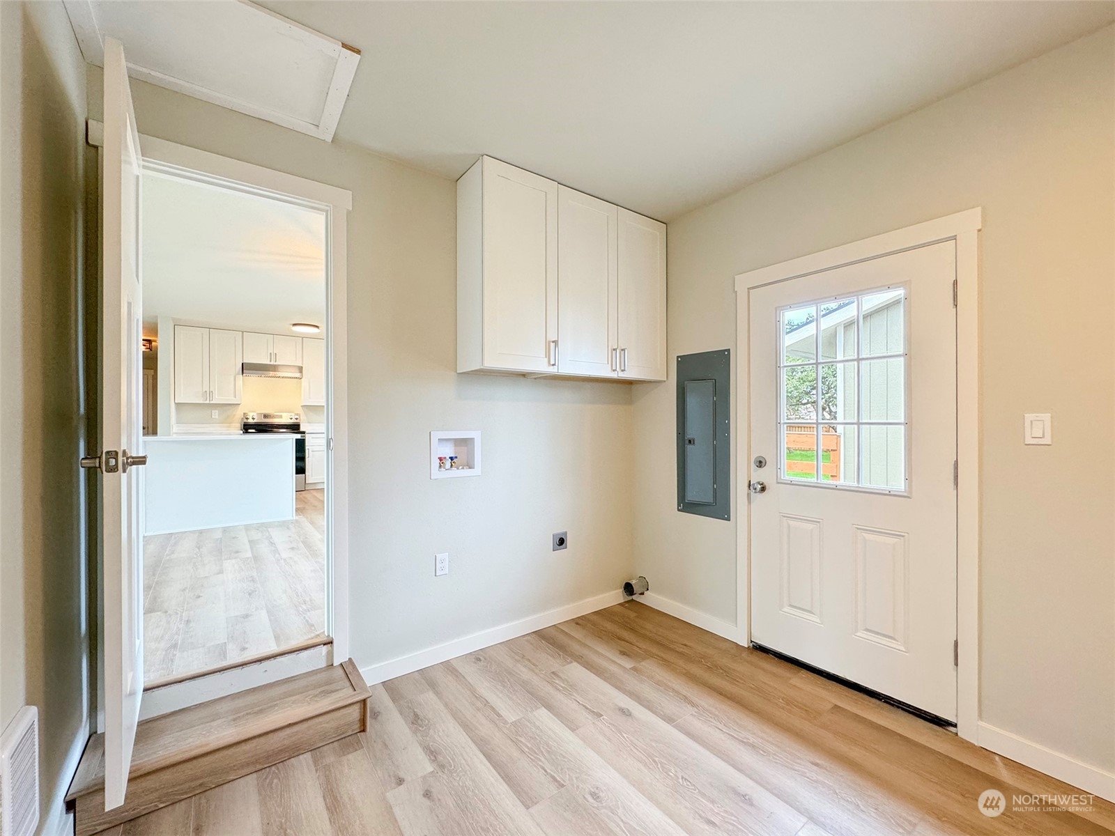 218 North Matriotti Avenue Sequim, WA 98382 - Photo 29 of 40 an empty room with wooden floor and windows