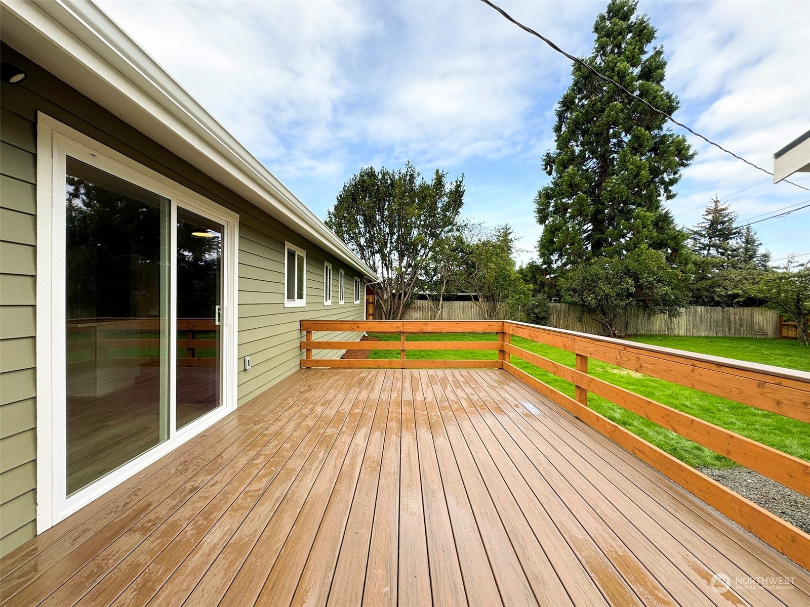 218 North Matriotti Avenue Sequim, WA 98382 - Photo 31 of 40 a view of balcony with a swimming pool and wooden floor