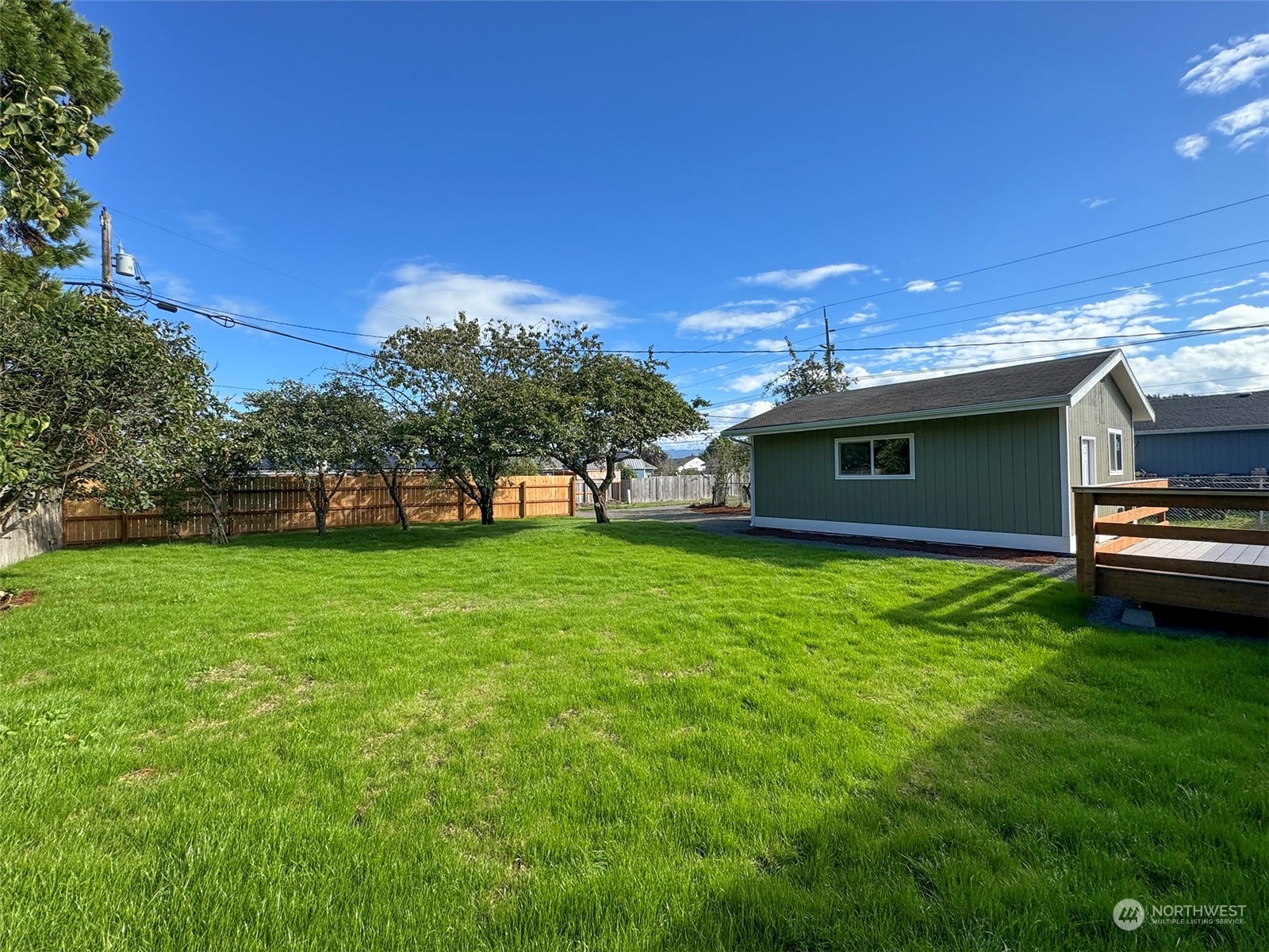 218 North Matriotti Avenue Sequim, WA 98382 - Photo 33 of 40 a view of a house with a backyard