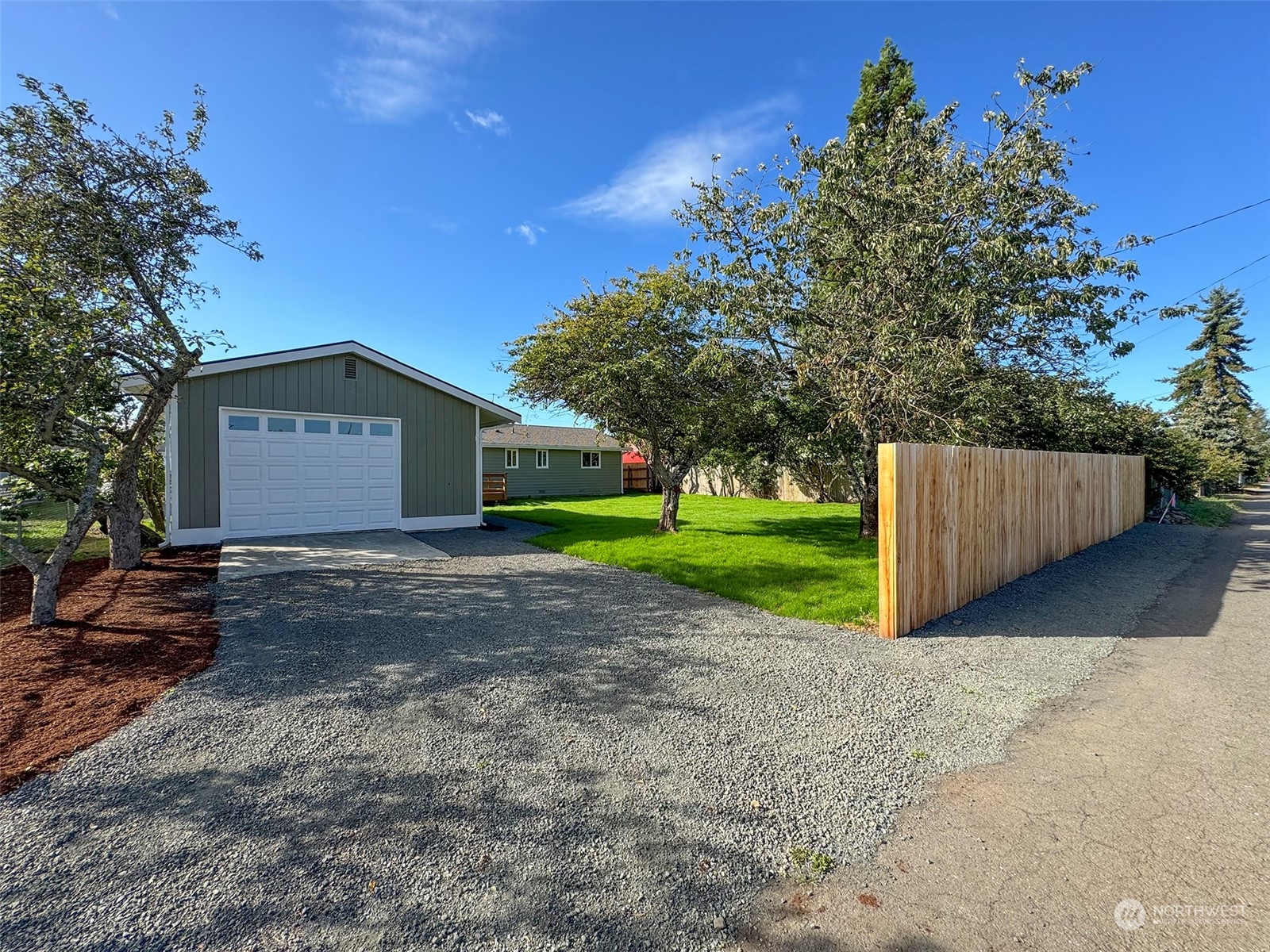 218 North Matriotti Avenue Sequim, WA 98382 - Photo 35 of 40 a view of a house with a yard and large tree