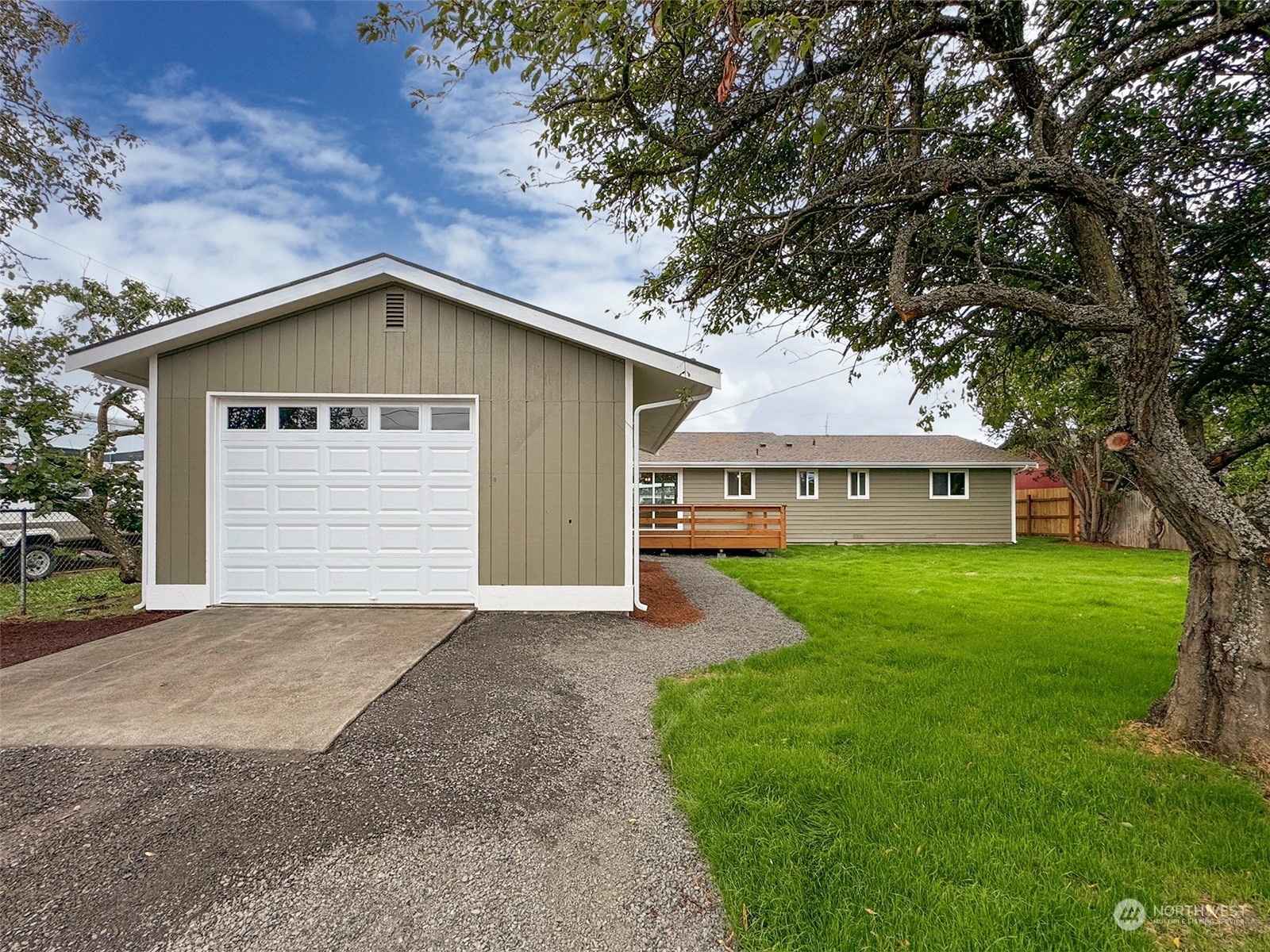 218 North Matriotti Avenue Sequim, WA 98382 - Photo 36 of 40 a front view of a house with a garden and yard