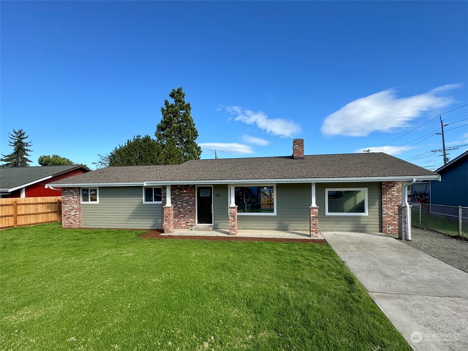218 North Matriotti Avenue Sequim, WA 98382 - Photo 39 of 40 a front view of house with a garden and patio