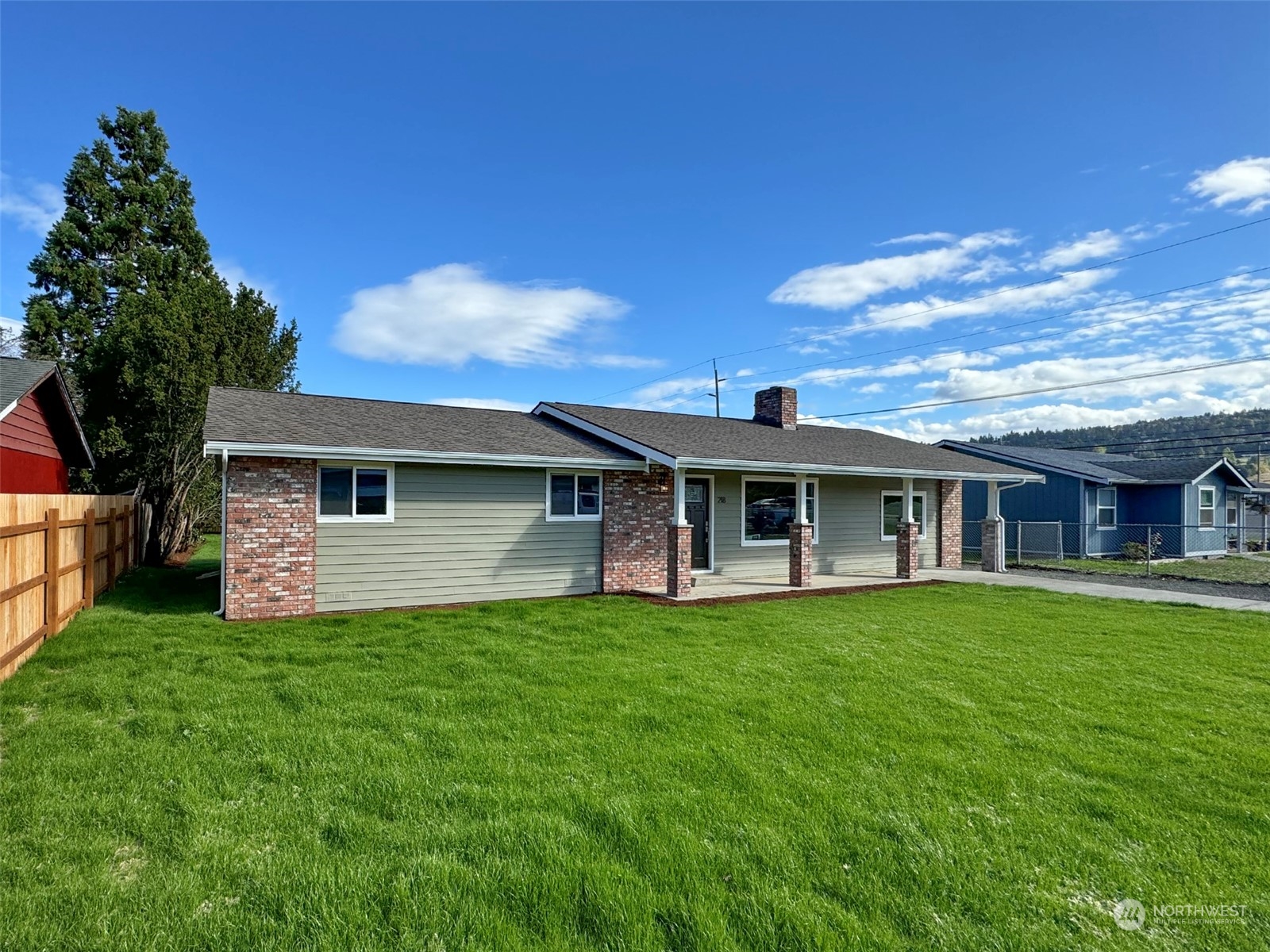 218 North Matriotti Avenue Sequim, WA 98382 - Photo 40 of 40 a front view of a house with a garden