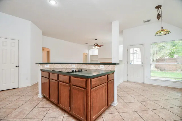 a kitchen with a stove and a sink