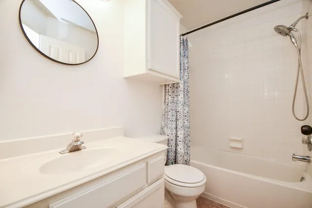 a bathroom with a sink a toilet and a bathtub