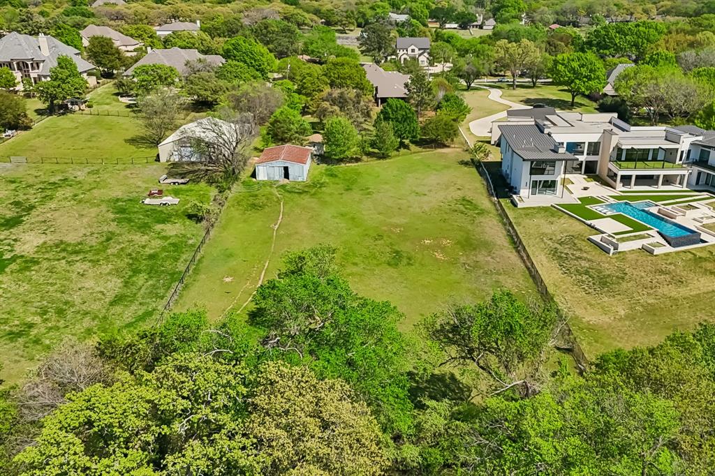4604 Bill Simmons Road Colleyville, TX 76034 - Photo 6 of 22 an aerial view of residential houses with outdoor space and trees