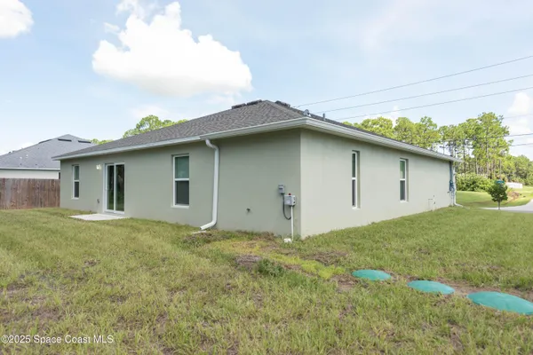 a house with yard in front of it