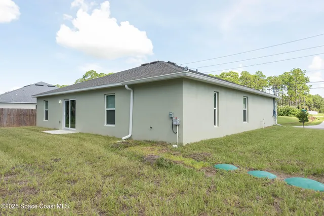 a house with yard in front of it