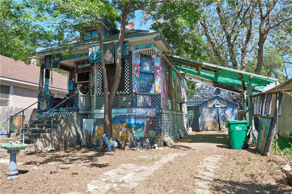 a view of street and large tree