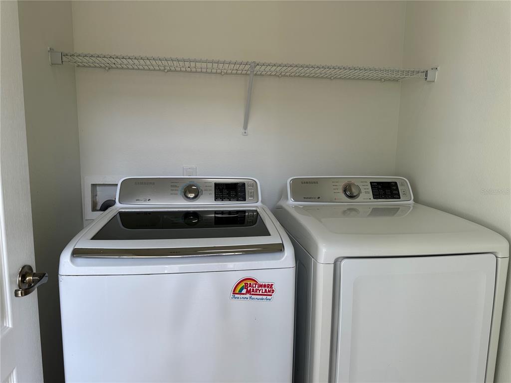 7668 Billingham Street Windermere, FL 34786 - Photo 11 of 15 a utility room with dryer and washer