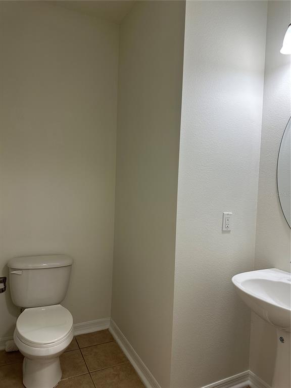 7668 Billingham Street Windermere, FL 34786 - Photo 12 of 15 a white toilet sitting next to a shower