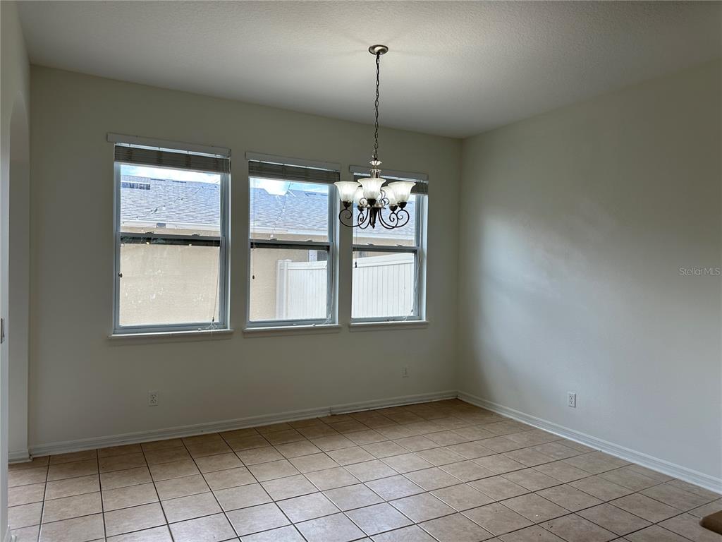 7668 Billingham Street Windermere, FL 34786 - Photo 5 of 15 a view of an empty room with a window