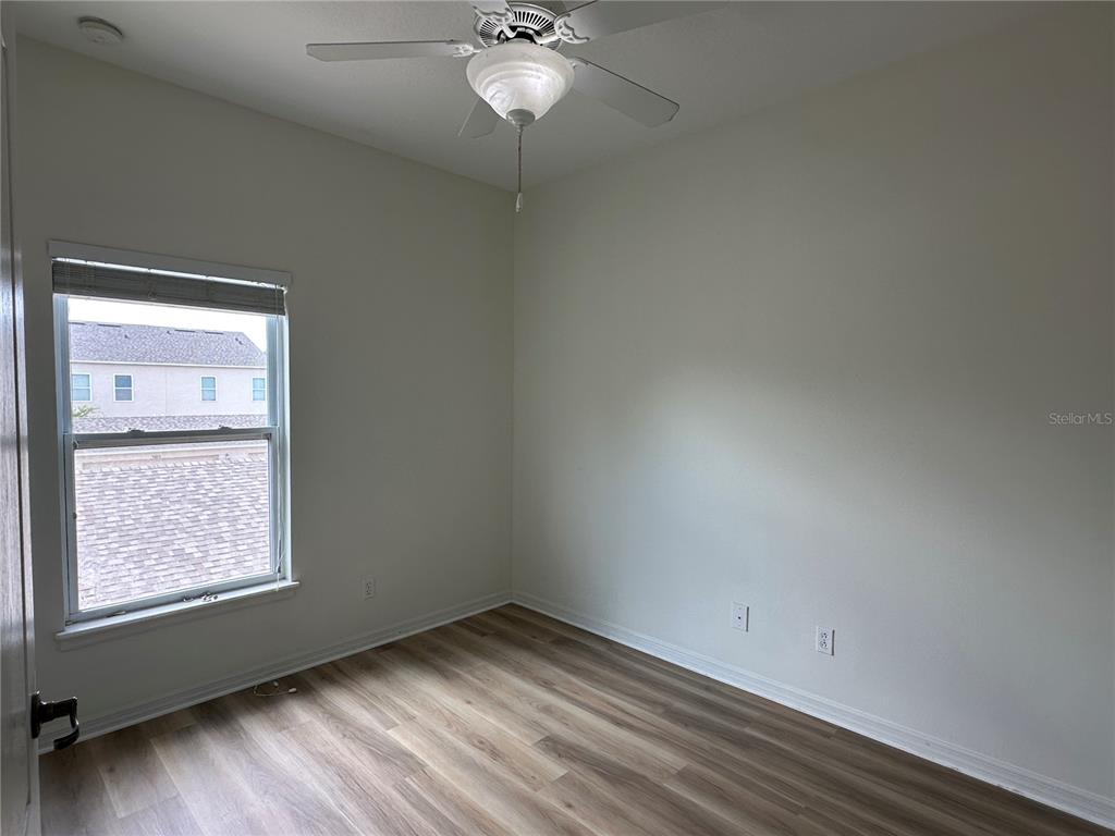 7668 Billingham Street Windermere, FL 34786 - Photo 9 of 15 an empty room with a window