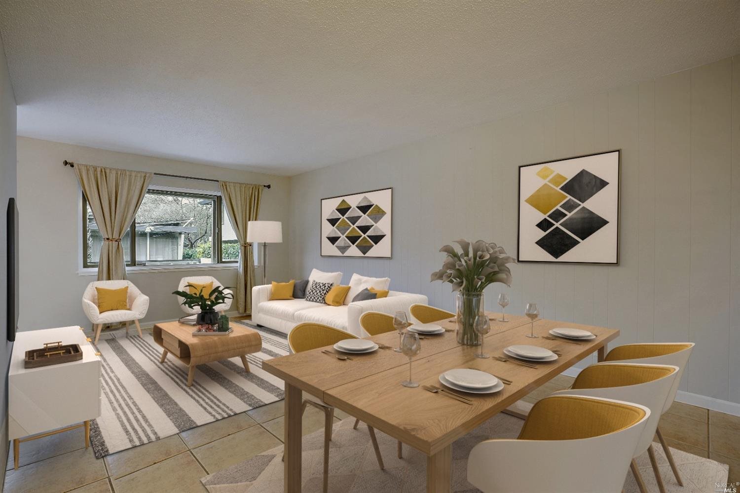 a view of a dining room with furniture a rug and wooden floor