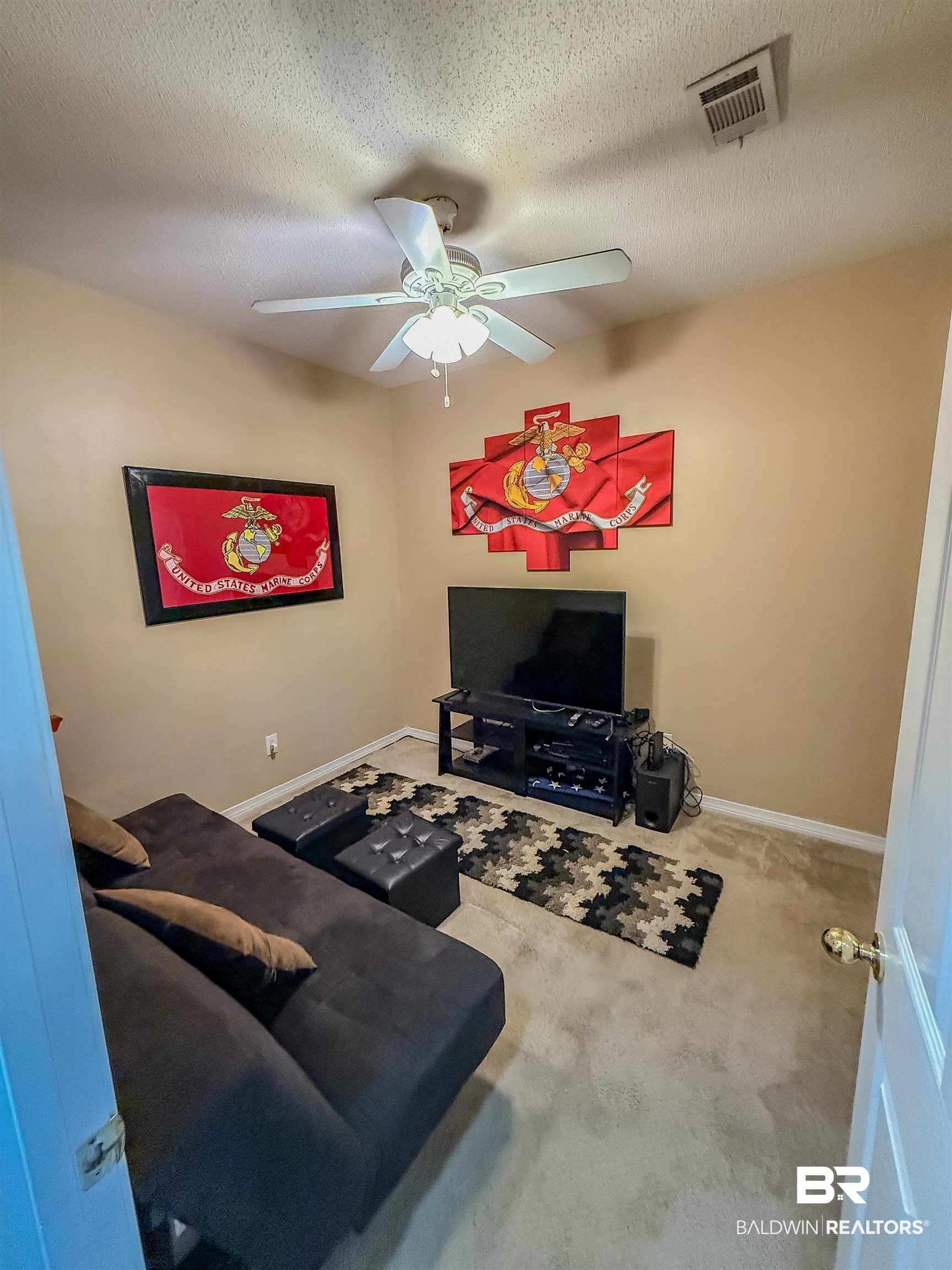 2651 South Juniper Street Foley, AL 36535 - Photo 14 of 20 Living area with carpet floors, a textured ceiling, and ceiling fan