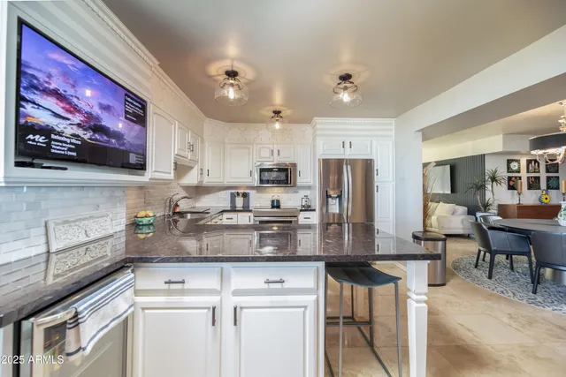 a living room with furniture and a lamp