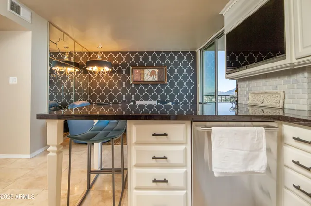 a view of a bedroom with closet and cabinet