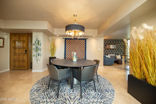 a spacious bathroom with a granite countertop sink a mirror and a shower