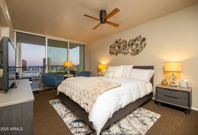 a spacious bathroom with a granite countertop sink a mirror and a shower