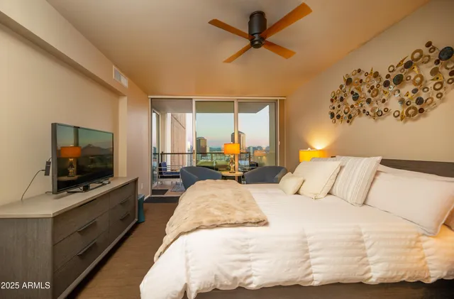 a bathroom with a granite countertop sink a mirror and a shower