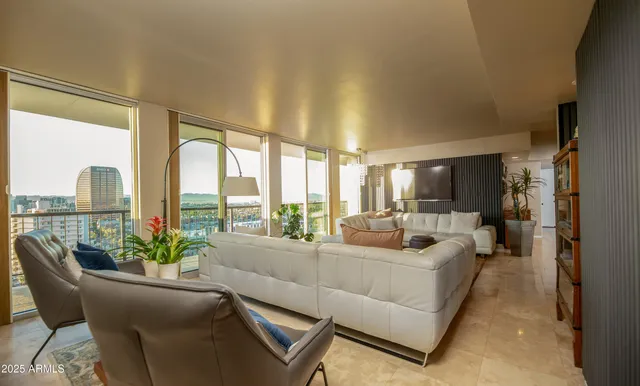 a living room with furniture and a large window